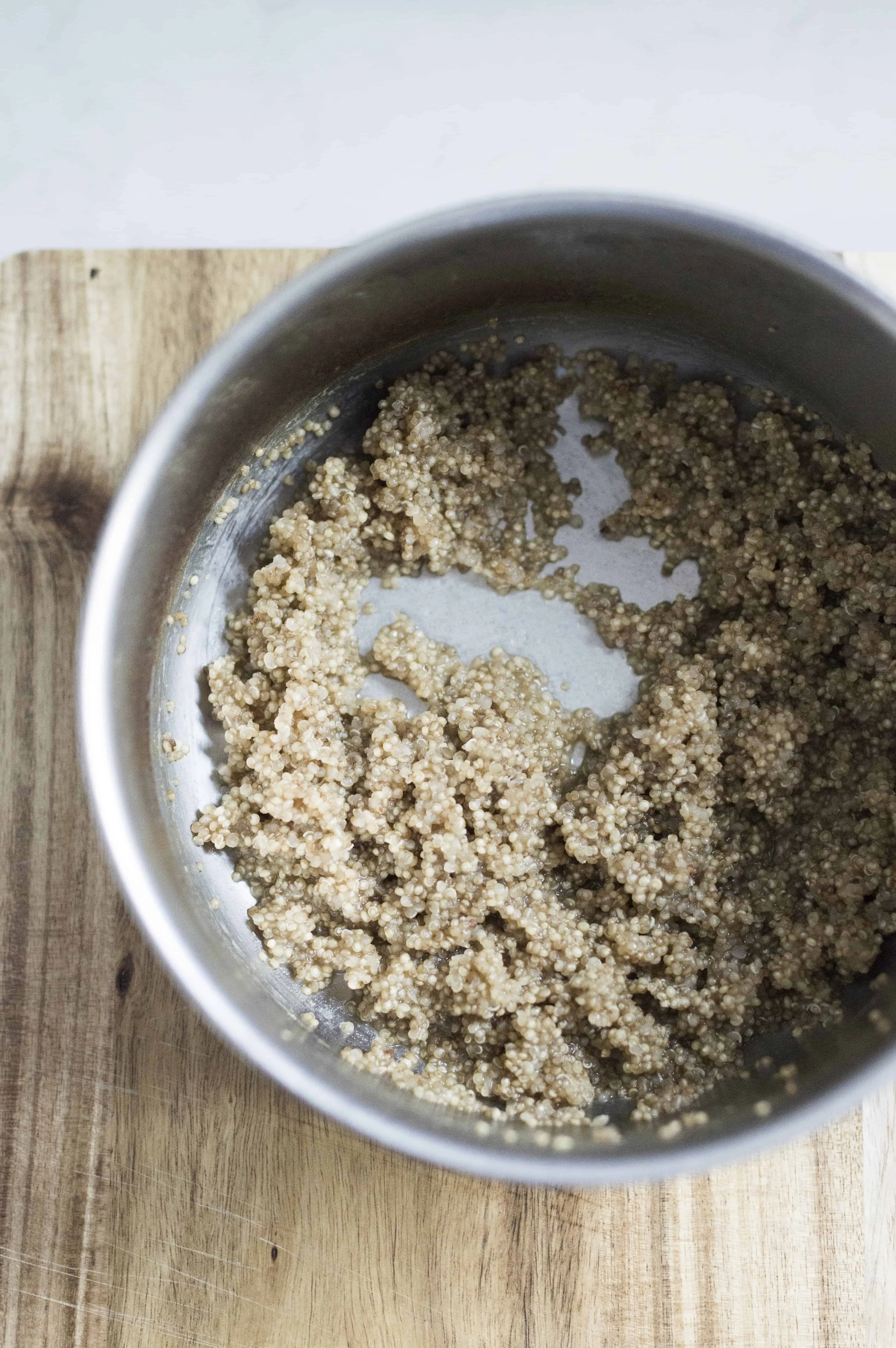 Saucepan of quinoa that has failed to cook properly