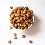 Small bowl of crispy roasted chickpeas on bench