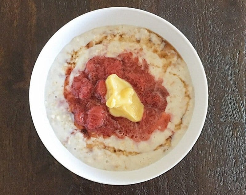 Food fail! A bowl of ugly claggy porridge topped with stewed strawberries and lime curd