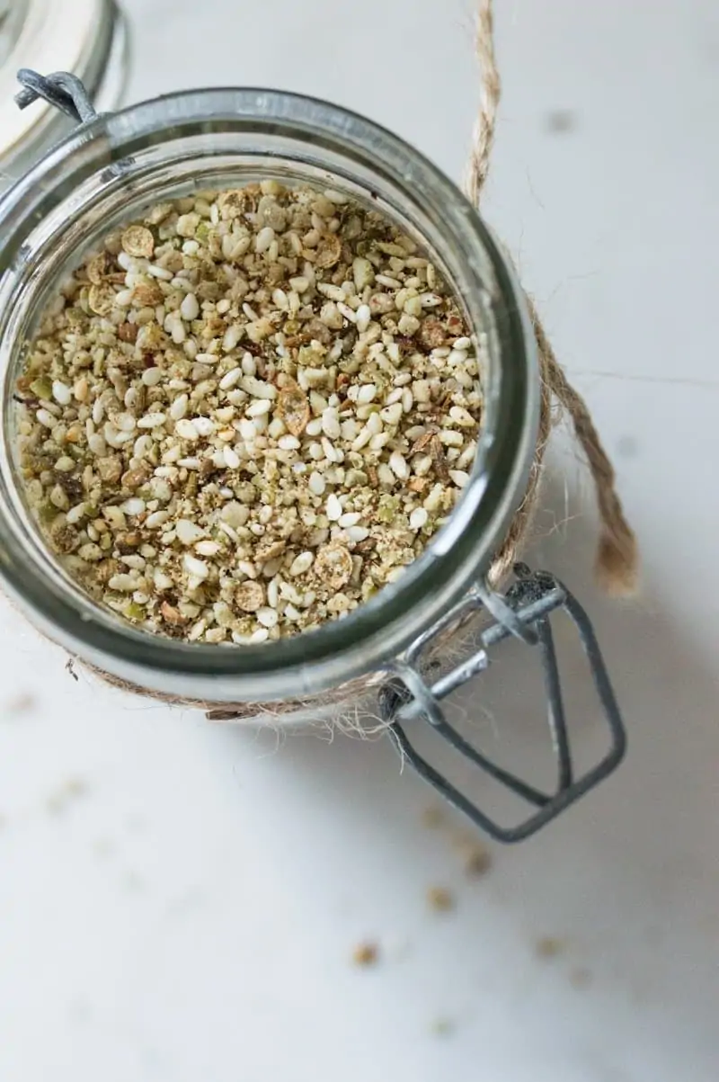 Glass jar filled with middle eastern condiment called dukkah