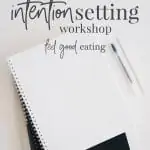 Note pads and pens on a desk with a keyboard in the background. Text overlay reads: intention setting workshop. feel good eating