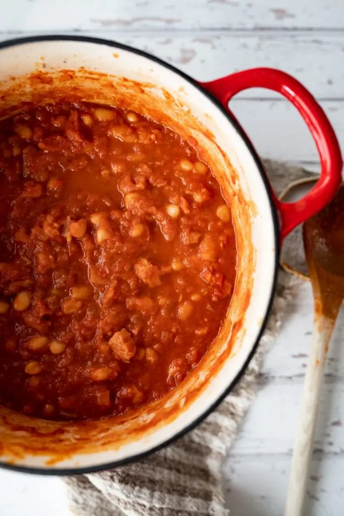 A close up of a pot of smoky baked beans