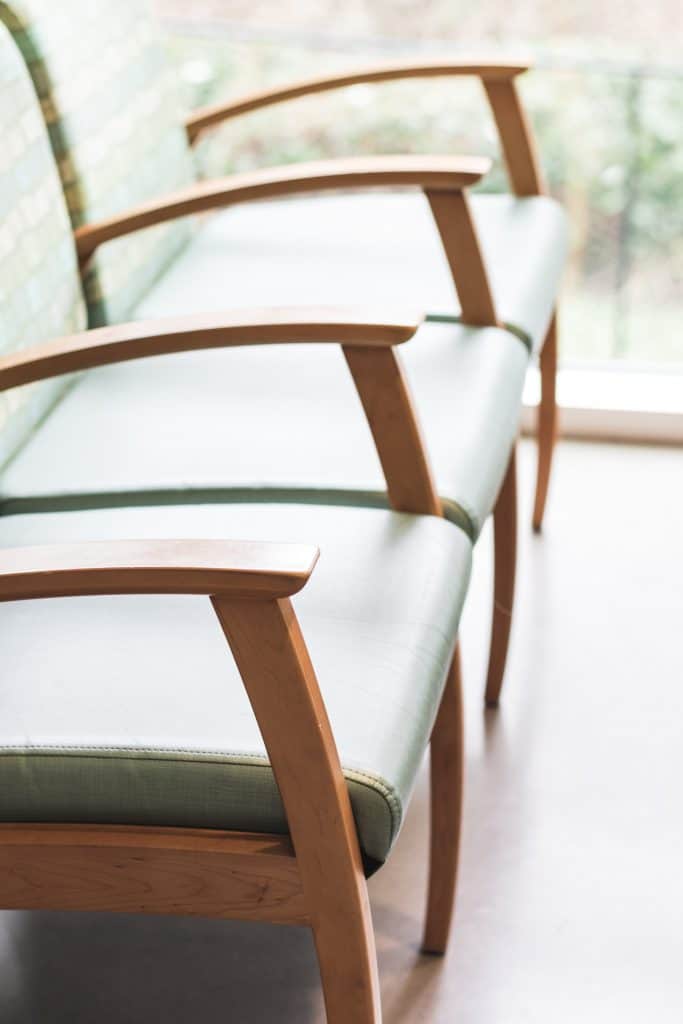 A close up of a row of waiting room chairs